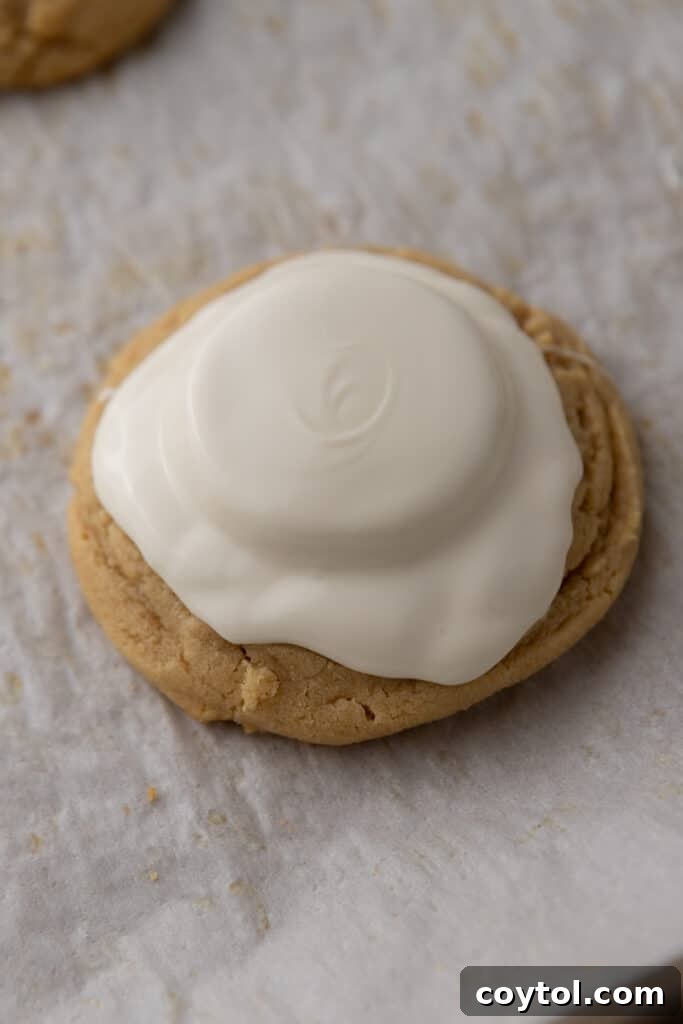 white chocolate melted over the peanut butter cup and top of the cookie