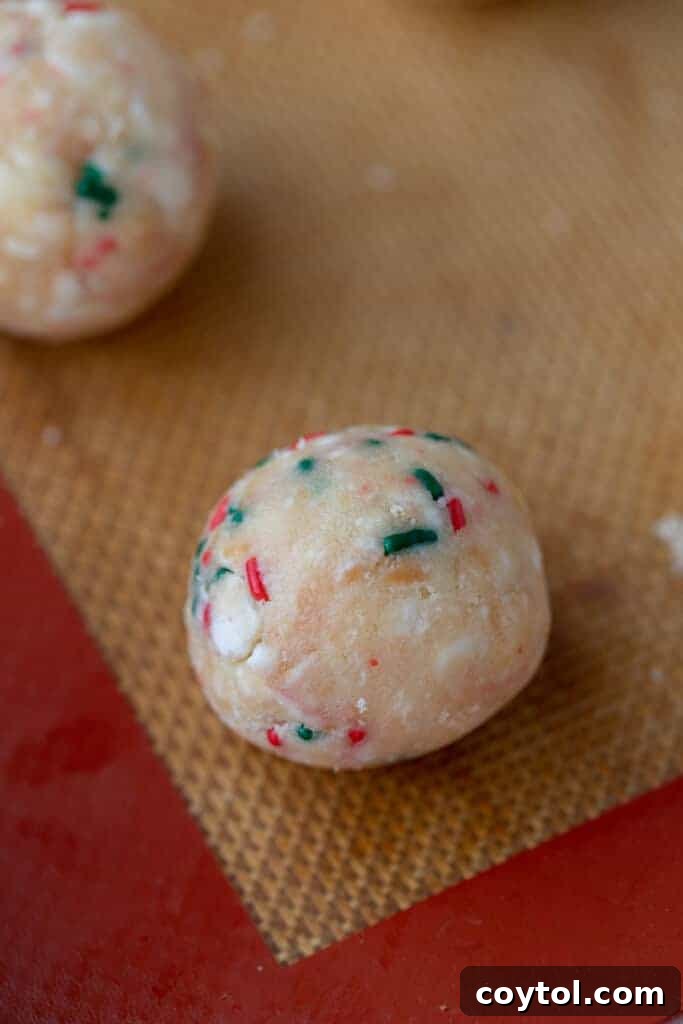 Whip Up Little Debbie Christmas Tree Cake Truffles No Baking Required 7 truffle ball rolled up on a baking sheet