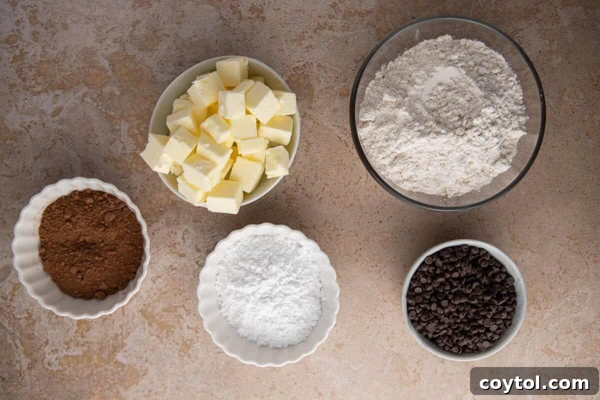 Ingredients for chocolate cookies arranged in small bowls.
