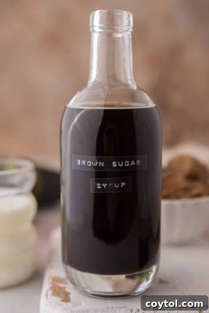 A side shot of homemade Starbucks brown sugar syrup in a glass jar, ready for use.