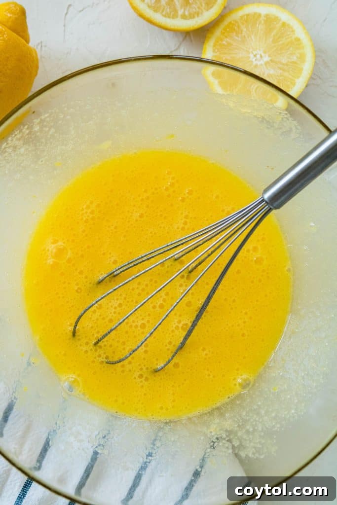 whisking lemon bars filling