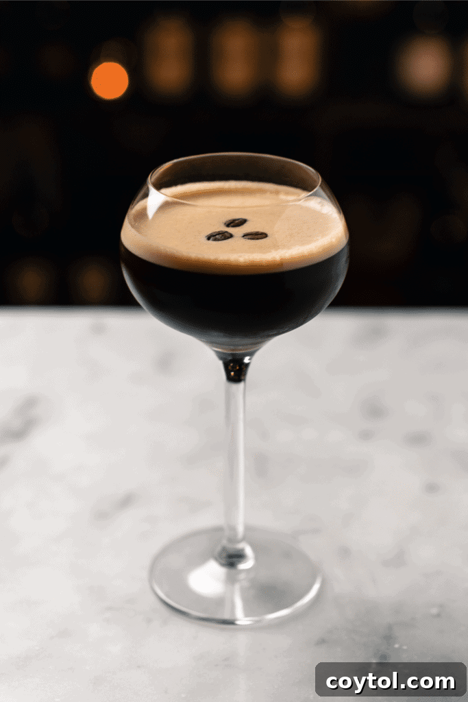 Elegant cold brew cocktail in a glass with coffee beans