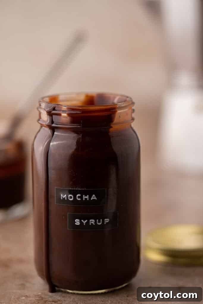 Homemade coffee mocha syrup in a glass jar