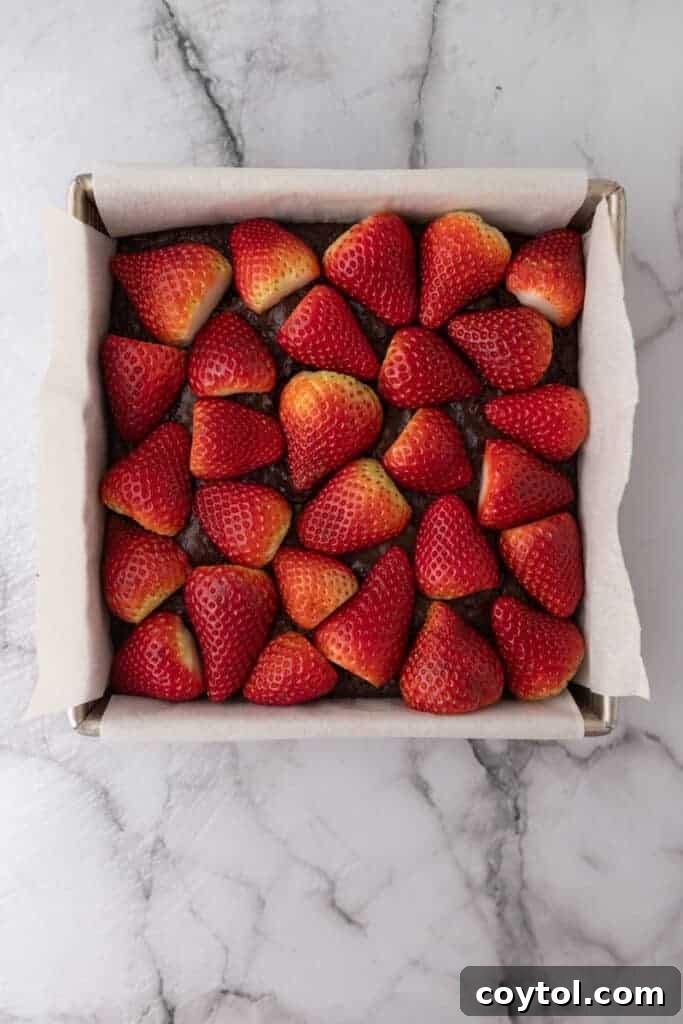 Strawberries on top of fudge brownie