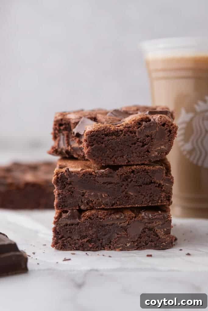 three squares of the starbucks brownies recipe stacked on top of each other