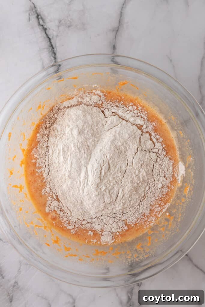 flour with batter in a clear bowl