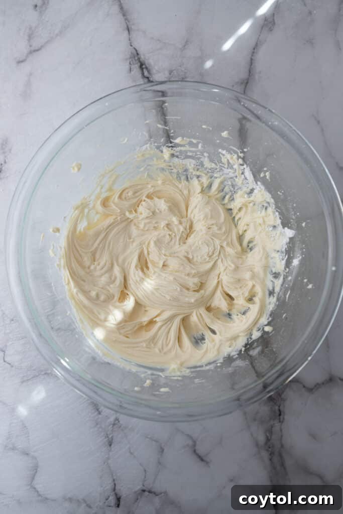 Partially mixed ingredients in a bowl, showing the initial stages of combining