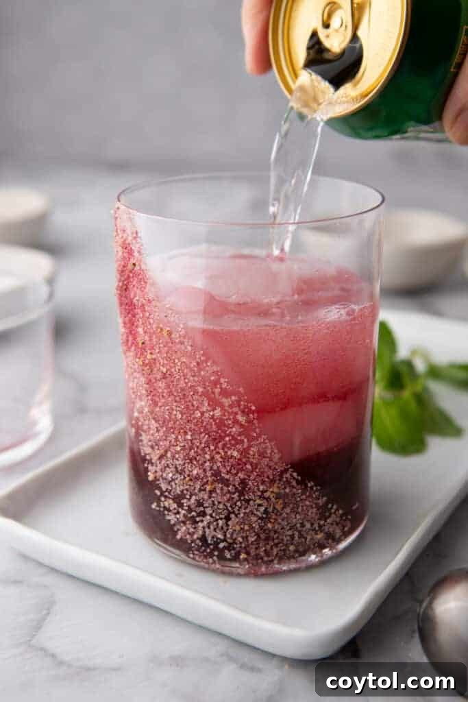 sparkling water being poured into the glass
