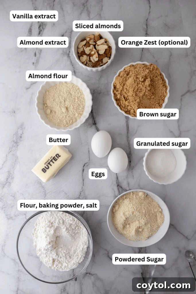 All the dry and wet ingredients for almond croissant blondies laid out on a baking surface.