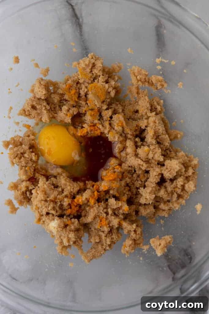 Wet ingredients for the blondie base unmixed in a bowl.