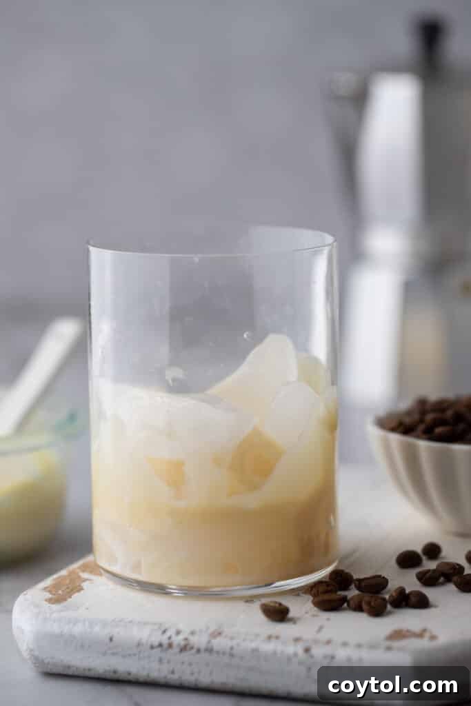 Easy Homemade Sweet Creamy Spanish Latte 4 sweetened condensed milk in a glass with ice