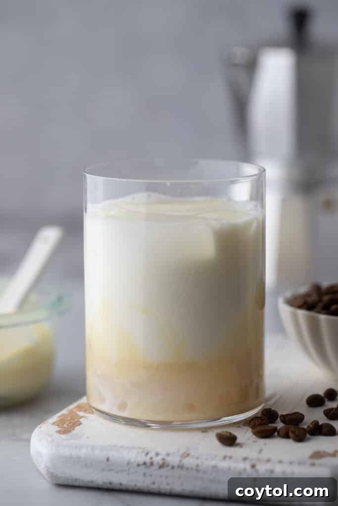Easy Homemade Sweet Creamy Spanish Latte 5 milk and sweetened condensed milk in a glass with ice