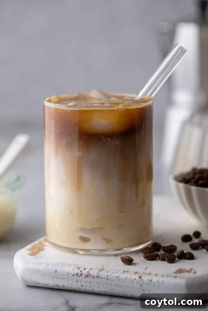 Easy Homemade Sweet Creamy Spanish Latte 7 a spanish latte recipe in a cup with a straw