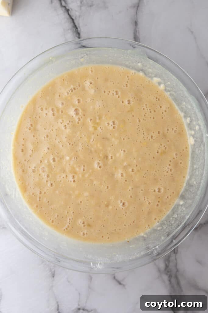 The smooth, perfectly mixed batter for the Tornado Cake in a large bowl, ready for baking.