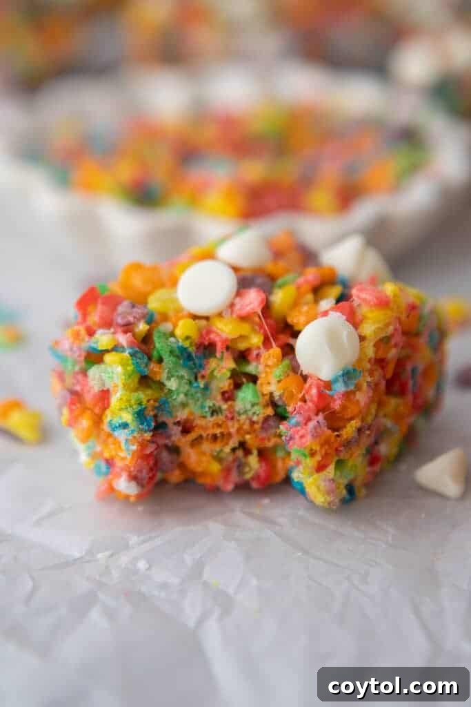 Close up of Fruity Pebbles rice krispies with a bite taken out of them