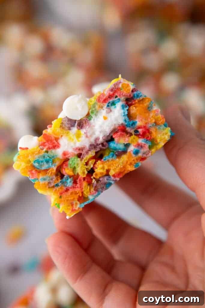 Hand holding Fruity Pebbles Rice Krispies 