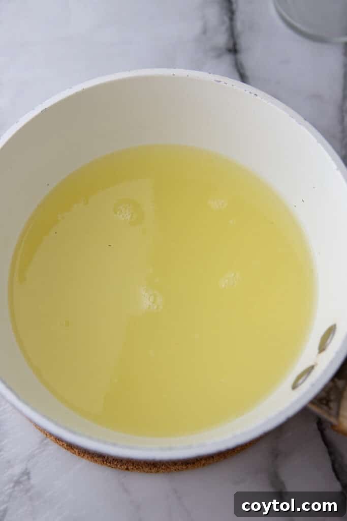 Easy Homemade Lemon Sour Mix Recipe 5 Lemon and lime juice added to simple syrup in a pot.