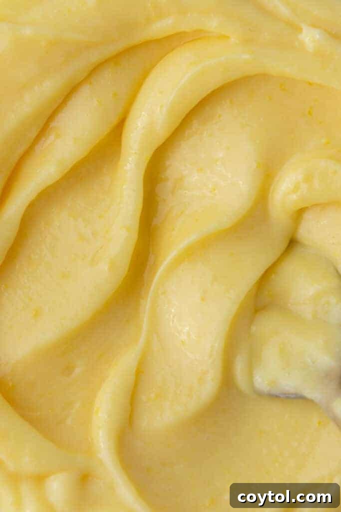 Microwave Lemon Curd: Zesty Perfection in Minutes 12 Close-up overhead shot of silky microwave lemon curd in a jar.
