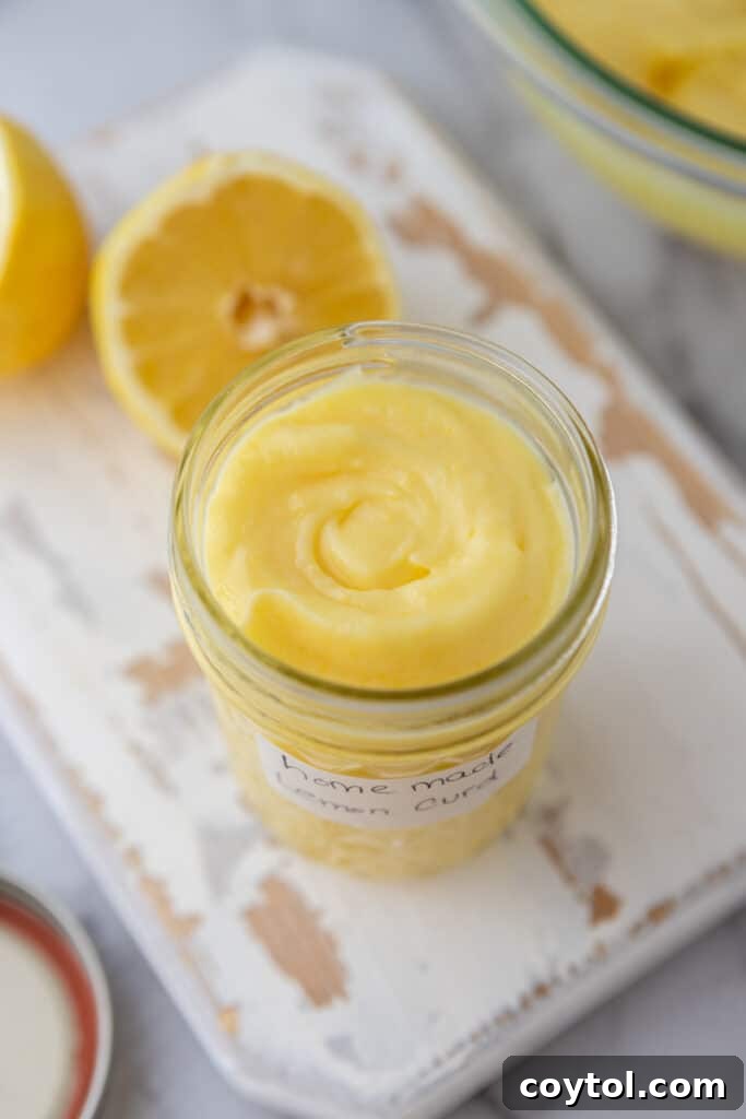 Microwave Lemon Curd: Zesty Perfection in Minutes 13 Angled overhead shot of microwave lemon curd in a glass jar, ready to be served.
