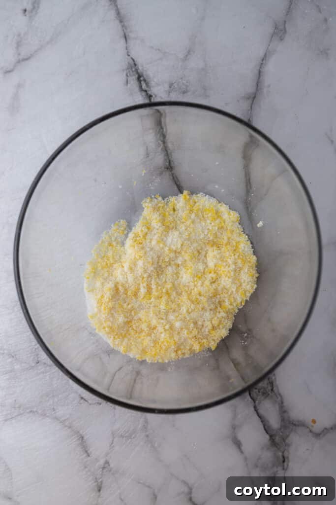 Microwave Lemon Curd: Zesty Perfection in Minutes 5 Close-up of sugar and lemon zest in a bowl before mixing.