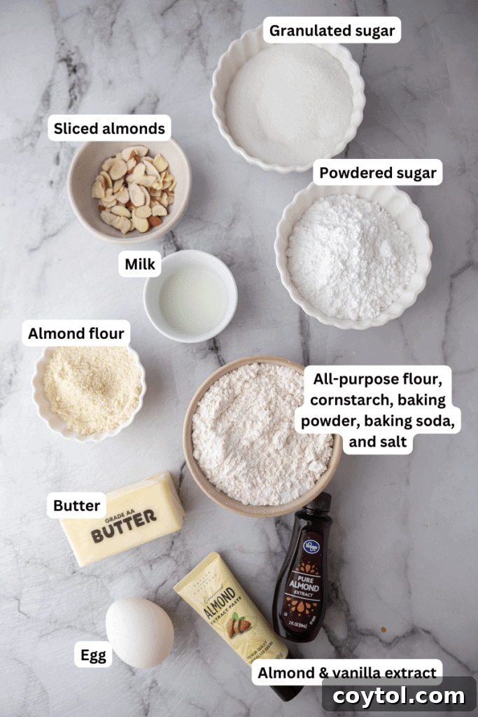 Essential ingredients laid out for baking almond sugar cookies