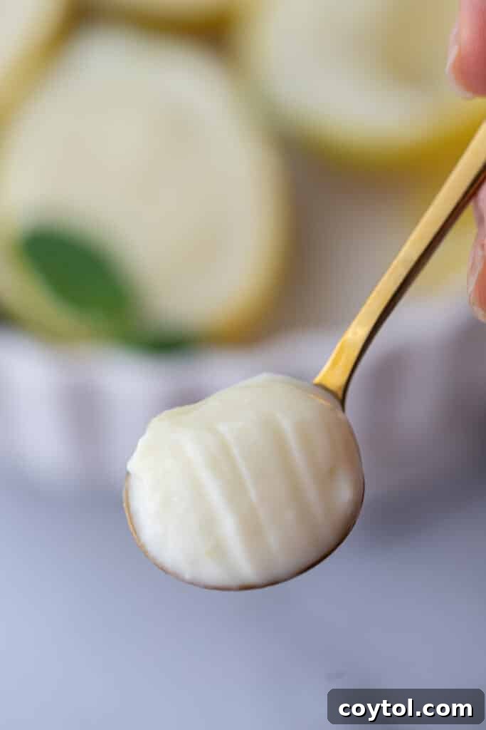 easy lemon posset recipe on a spoon