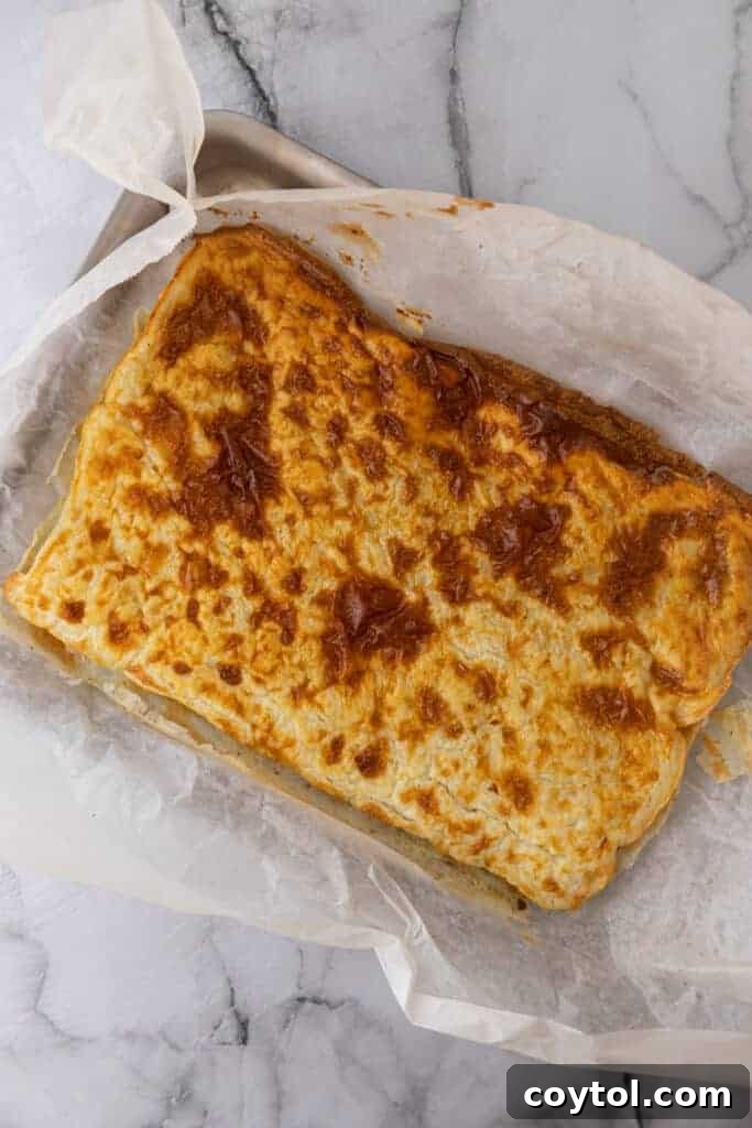 The Viral High-Protein Cottage Cheese Wrap Everyone's Raving About 9 Baked cottage cheese wrap on a pan