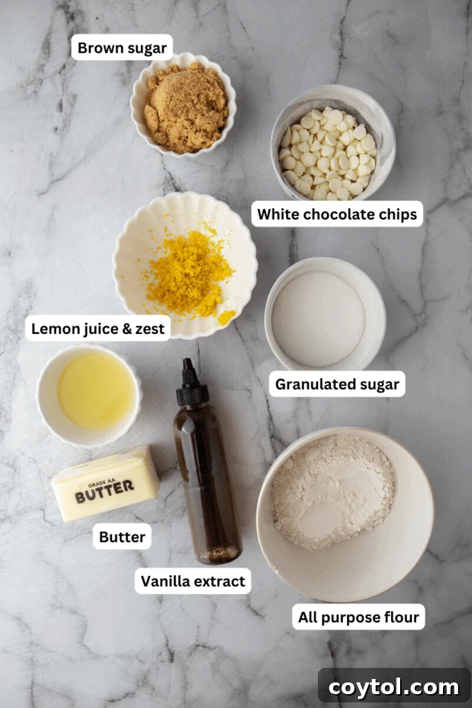 Arrangement of ingredients for edible lemon cookie dough, including flour, butter, sugar, lemons, and white chocolate chips