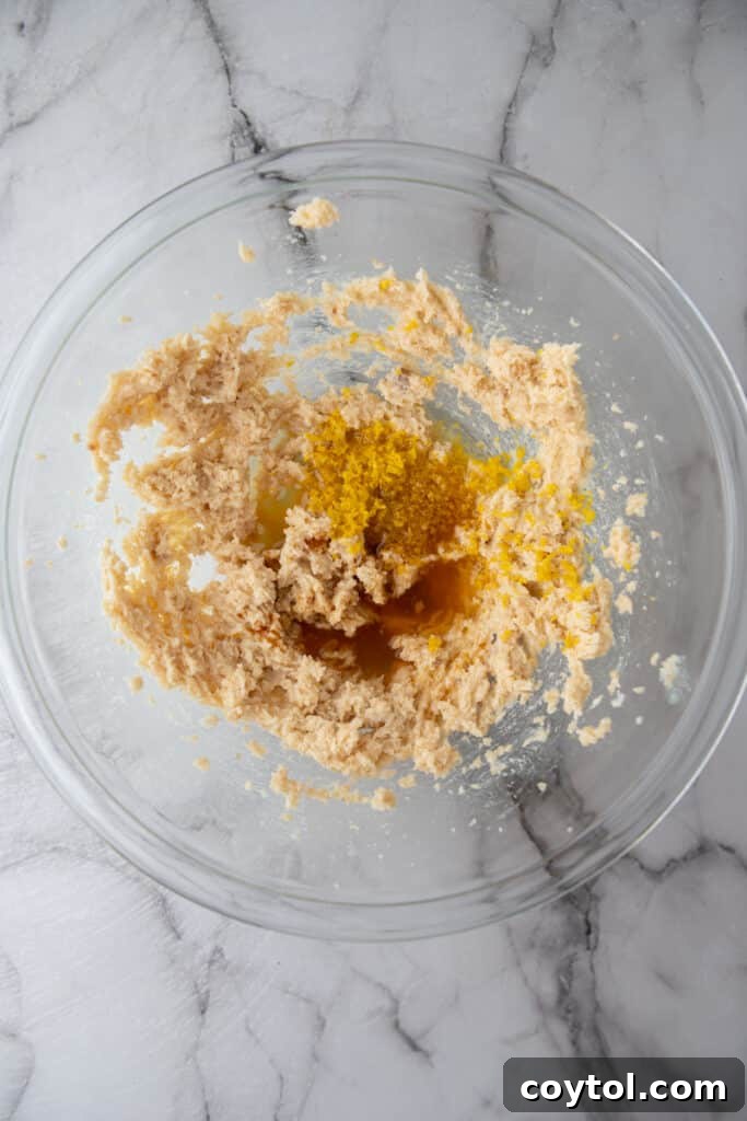 Wet ingredients (butter, granulated sugar, brown sugar) creamed together until light and fluffy in a bowl