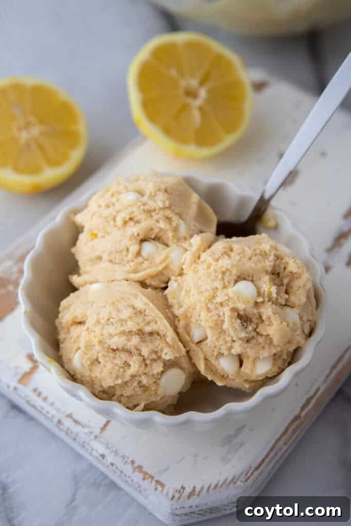 Several balls of edible lemon cookie dough in a bowl, ready to be served