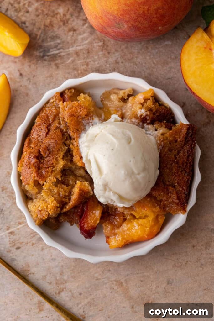 Overhead shot of the old fashioned peach cobbler recipe in a baking dish