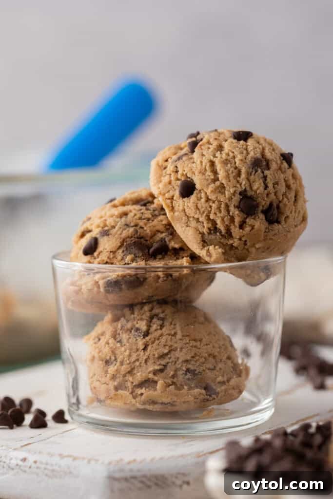 Irresistible Edible Chocolate Chip Cookie Dough 12 A straight-on, eye-level shot of a bowl brimming with brown butter edible chocolate chip cookie dough, showing its irresistible texture and inviting appearance.