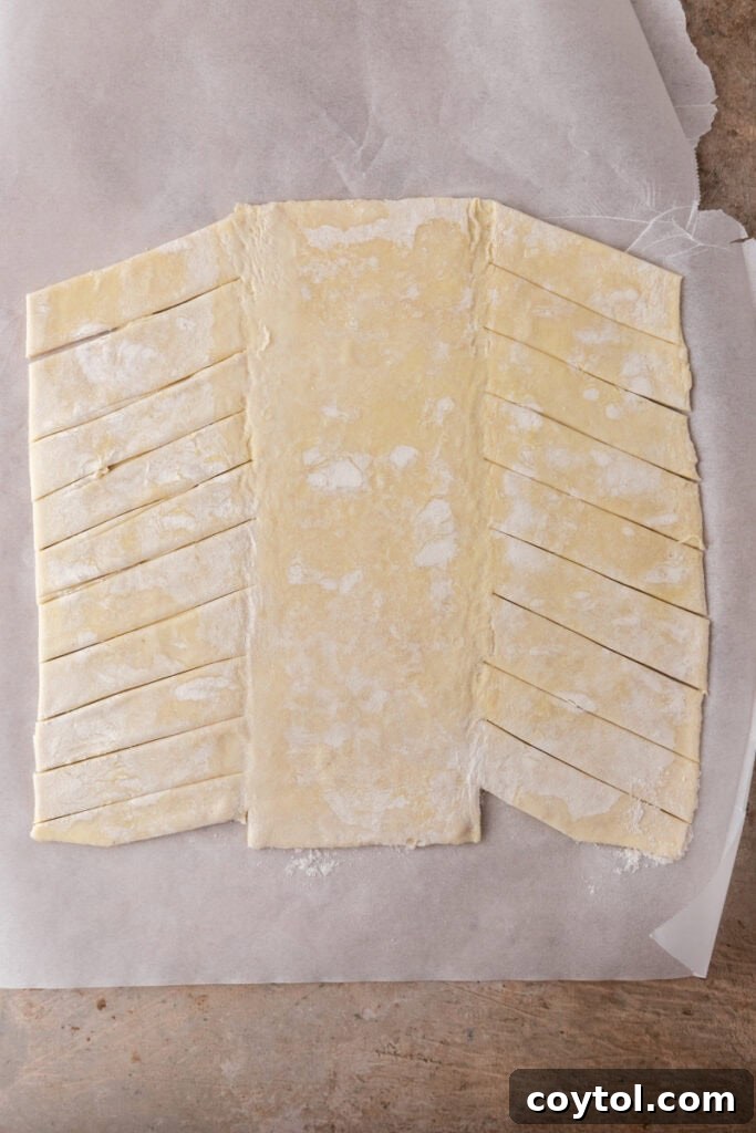 Puff pastry sheet rolled out and cut into diagonal strips
