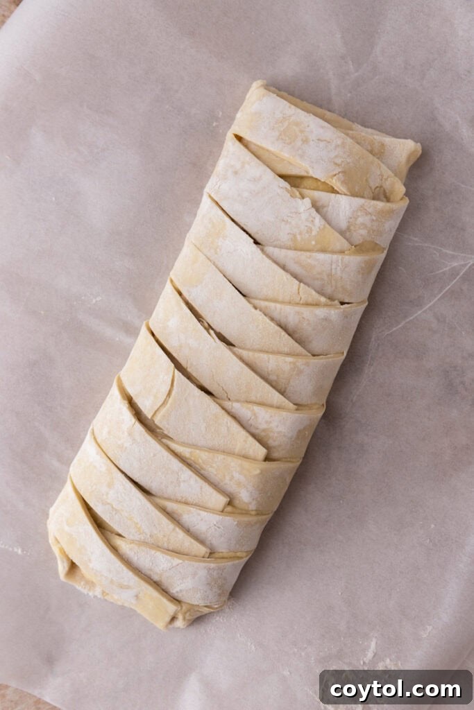 Braided puff pastry with frangipane filling, ready for brushing