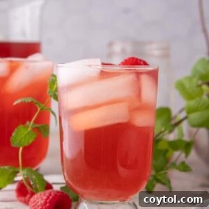 Raspberry Iced Tea recipe in a glass with ice
