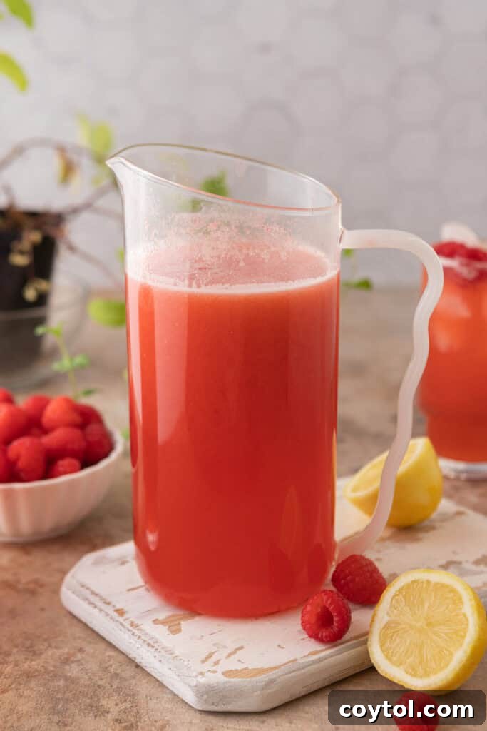 Raspberry lemonade recipe in a pitcher ready to be served