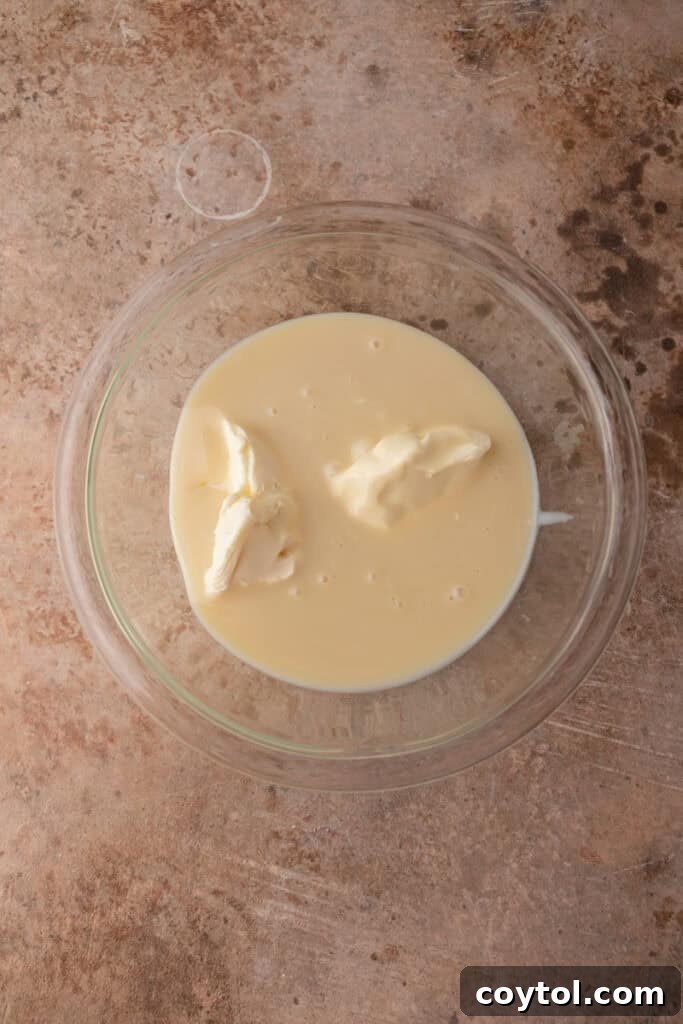 Unmixed heavy cream in a bowl, ready to be whipped.