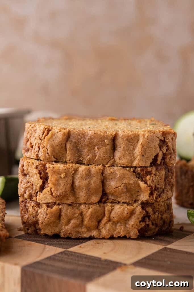 A stack of golden zucchini bread slices, ready to be enjoyed.