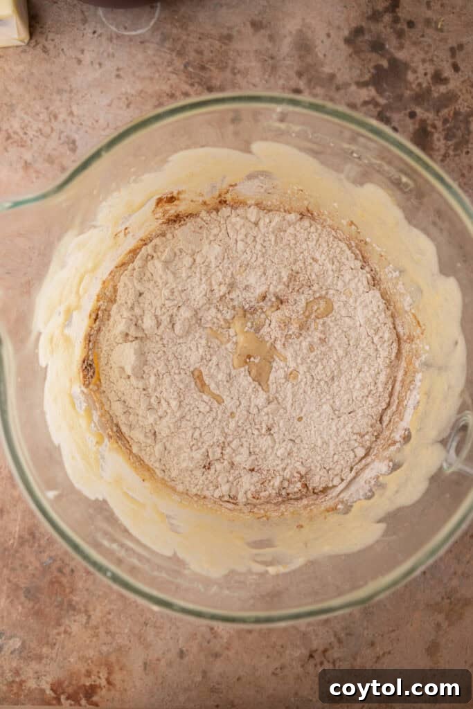 Creamed butter and sugars in a mixing bowl, light and fluffy.