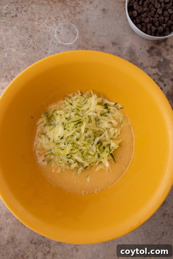 Wet ingredients for zucchini bread in a bowl