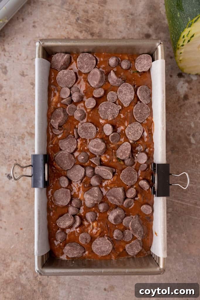 Raw double chocolate zucchini bread batter in a loaf pan, ready for baking