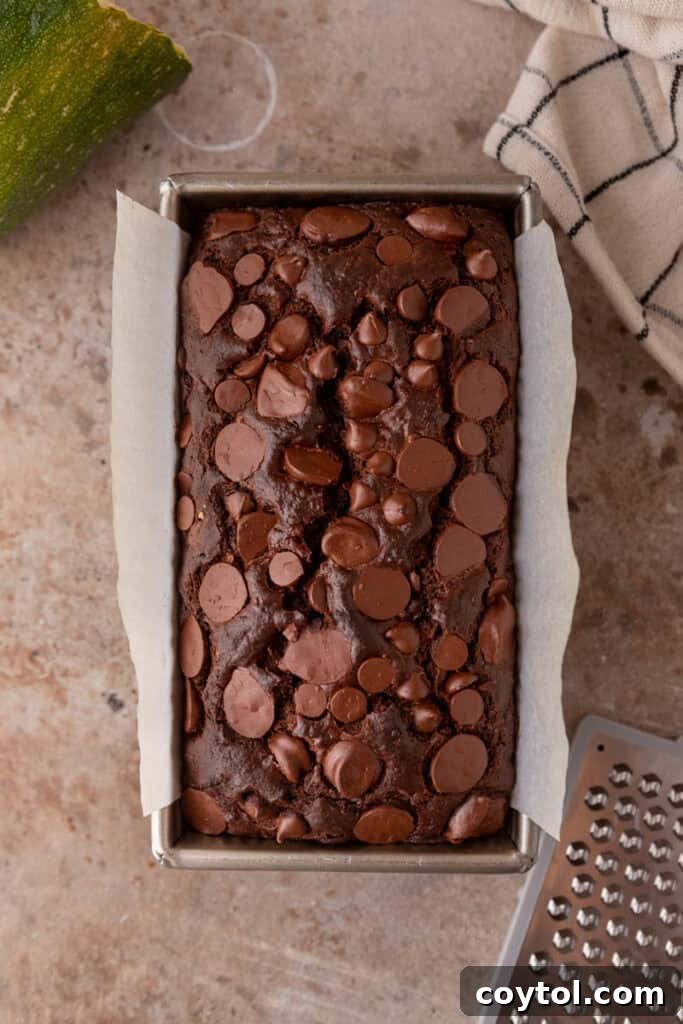 Cooked double chocolate zucchini bread in a loaf pan, freshly baked