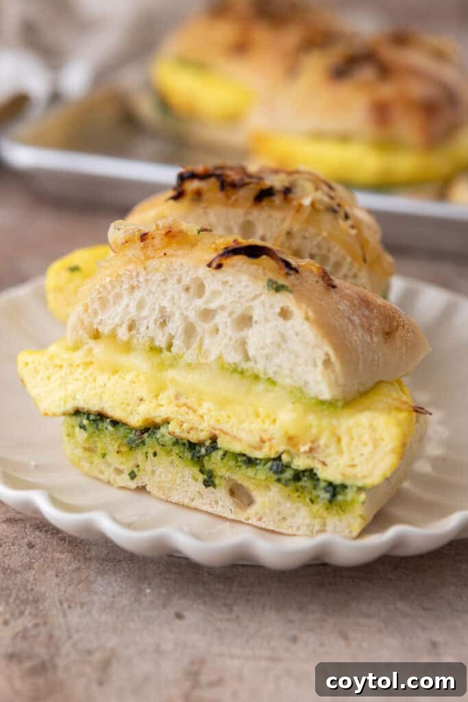 Elevate Your Breakfast Starbucks Style Egg Kale Pesto Mozzarella Sandwich 12 Starbucks egg kale pesto mozzarella sandwich recipe cut in half
