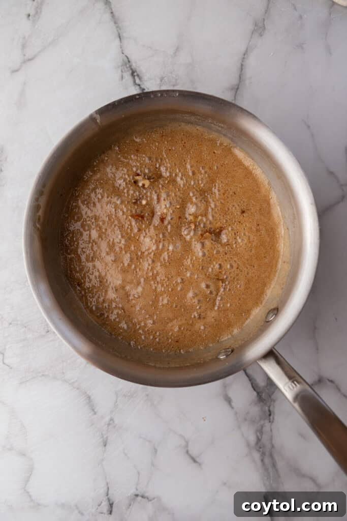partially cooked mixed ingredients in a pot for pralines