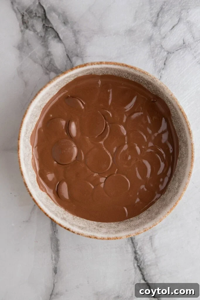 Irresistible Chocolate Pretzel Perfection 5 candy melting in a bowl