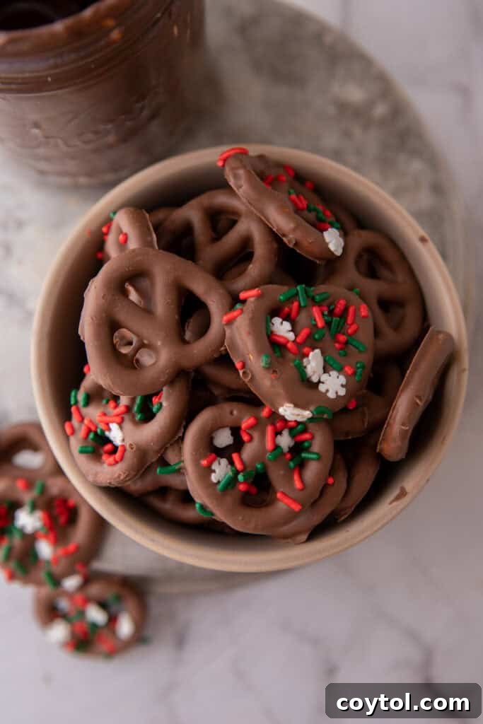 Irresistible Chocolate Pretzel Perfection 10 Chocolate covered pretzels recipe with sprinkles on them in a bowl