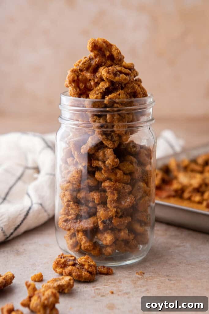 Holiday candied walnuts recipe in a mason jar