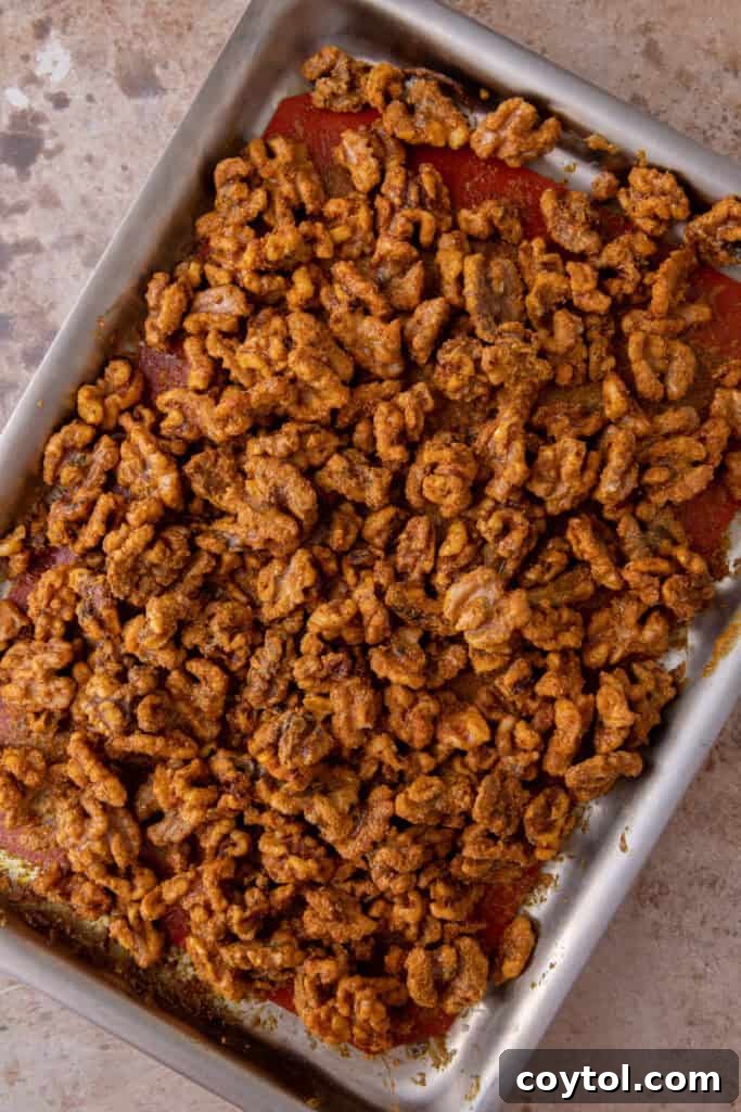 Holiday candied walnuts recipe done baking on a baking pan