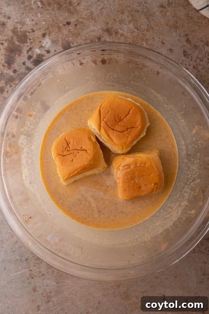 bread squares soaking in custard