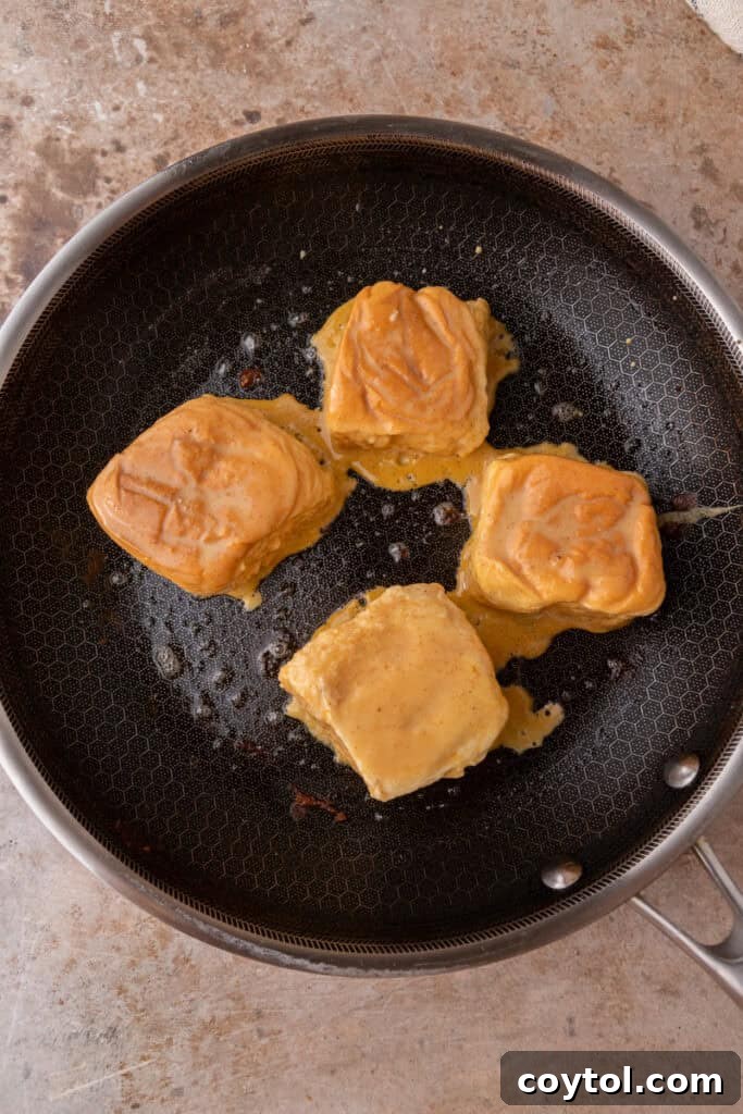 bread squares cooking on a pan